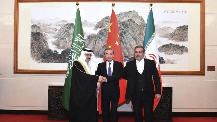 In this photo released by Xinhua News Agency, Ali Shamkhani, the secretary of Irans Supreme National Security Council, at right, shakes hands with Saudi national security adviser Musaad bin Mohammed al-Aiban, at left, as Wang Yi, Chinas most senior diplomat, looks on, at center, for a photo during a closed meeting held in Beijing, Saturday, March 11, 2023. Iran and Saudi Arabia agreed Friday to reestablish diplomatic relations and reopen embassies after seven years of tensions. The major diplomatic breakthrough negotiated with China lowers the chance of armed conflict between the Mideast rivals, both directly and in proxy conflicts around the region. (Luo Xiaoguang/Xinhua via AP)