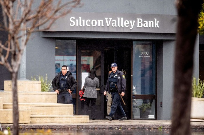 Police officers leave Silicon Valley Banks headquarters in Santa Clara, California on March 10, 2023. - US authorities swooped in and seized the assets of SVB, a key lender to US startups since the 1980s, after a run on deposits made it no longer tenable for the medium-sized bank to stay afloat on its own. (Photo by NOAH BERGER / AFP) (Photo by NOAH BERGER/AFP via Getty Images)