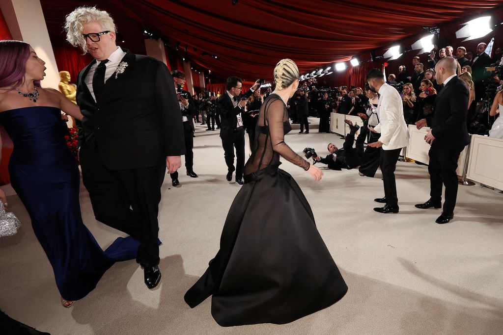 Lady Gaga and BloodPop react on the champagne-colored red carpet during the Oscars arrivals at the 95th Academy Awards in Hollywood, Los Angeles, California, U.S., March 12, 2023. REUTERS/Mario Anzuoni TPX IMAGES OF THE DAY