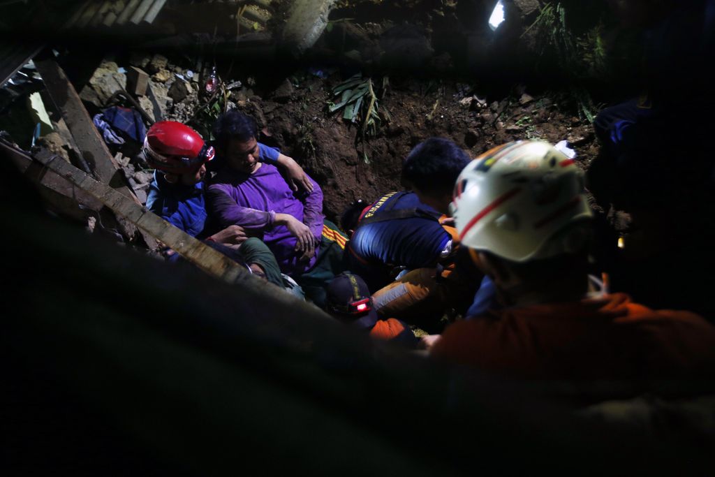 BOGOR, INDONESIA - 2023/03/15: A man rescued by the Search and Rescue team from one of the houses that were buried by a landslide. The landslide was caused by heavy rain which hit Bogor City for 4 hours at night. The landslide occurred in Empang Village, South Bogor District, Bogor City, hitting 5 houses with 13 people in them. Seven people who were evacuated, 4 people are still being searched for, and at least 2 of them died. (Photo by Fadli Akbar/Pacific Press/LightRocket via Getty Images)