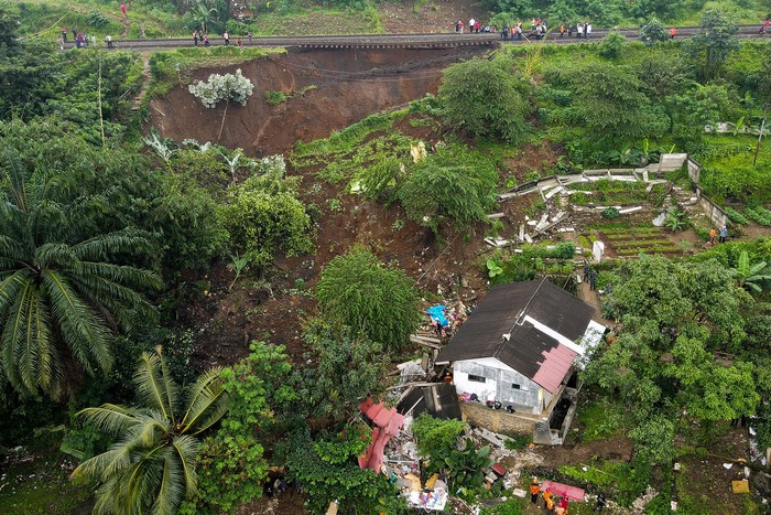 This aerial picture shows an evacuation effort by a rescue team to find victims buried in a landslide that was triggered by heavy rainfall in Bogor, on March 15, 2023. (Photo by ADITYA AJI / AFP) (Photo by ADITYA AJI/AFP via Getty Images)