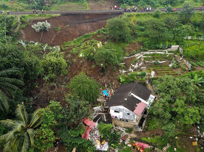 This aerial picture shows an evacuation effort by a rescue team to find victims buried in a landslide that was triggered by heavy rainfall in Bogor, on March 15, 2023. (Photo by ADITYA AJI / AFP) (Photo by ADITYA AJI/AFP via Getty Images)