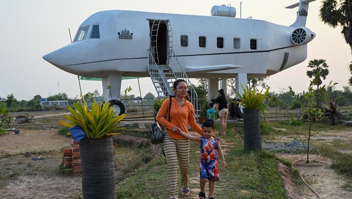 Local tourists visit the air plane house in Siem Reap province on March 12, 2023. (Photo by TANG CHHIN SOTHY / AFP) (Photo by TANG CHHIN SOTHY/AFP via Getty Images)