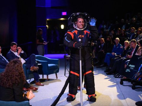 TOPSHOT - Chief Engineer Jim Stein wears the new spacesuit during the Axiom Space Artemis III Lunar Spacesuit event at Space Center Houston in Houston, Texas, on March 15, 2023. - 