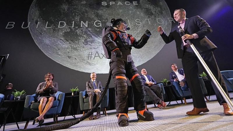 Axiom Space chief engineer Jim Stein demonstrates a prototype spacesuit, Wednesday, March 15, 2023, in Houston. NASA selected Axiom Space to design the spacesuits that its moonwalking astronauts will wear when they step onto the lunar surface later this decade. (AP Photo/David J. Phillip)