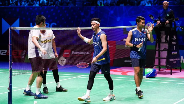 Indonesias Fajar Alfian (far right) and Muhammad Rian Ardianto celebrate victory over Indonesias Mohammad Ahsan and Hendra Setiawan (not pictured) during the Mens Doubles Final on day six of the YONEX All England Open Badminton Championships at the Utilita Arena Birmingham. Picture date: Sunday March 19, 2023. (Photo by Zac Goodwin/PA Images via Getty Images)
