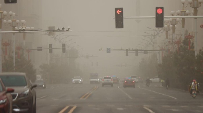 ZHANGYE, CHINA - MARCH 20, 2023 - Vehicles travel during a sandstorm in Zhangye, Gansu province, China, March 20, 2023. (Photo credit should read CFOTO/Future Publishing via Getty Images)
