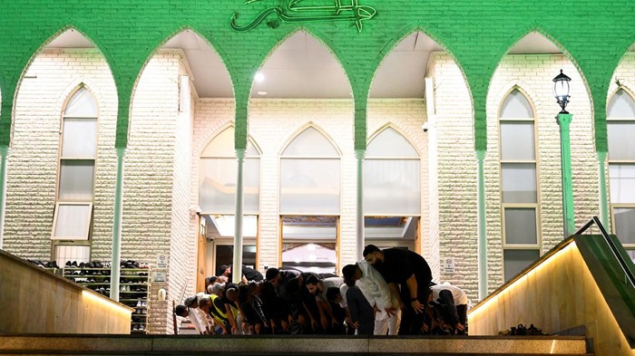 Muslim worshippers attend a prayer marking the start of the holy fasting month of Ramadan, outside Lakemba Mosque in suburb of Lakemba in Sydney, Australia, March 22, 2023. REUTERS/Jaimi Joy