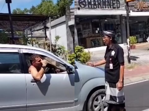 Pecalang di Pecatu menahan mobil bule yang berkendara di Labuan Sait saat perayaan Nyepi, sedangkan WNA itu diantar kembali ke penginapannya.