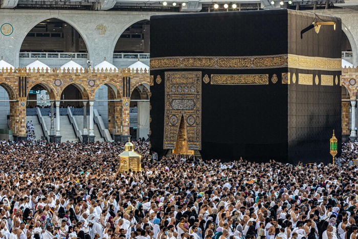 Muslim worshippers gather before the Kaaba, Islams holiest shrine, as they perform the Maghrib (sunset) prayer to mark the end of the first day of fasting in the holy month of Ramadan, at the Grand Mosque in the holy city of Mecca on March 23, 2023. (Photo by Abdel Ghani BASHIR / AFP) (Photo by ABDEL GHANI BASHIR/AFP via Getty Images)