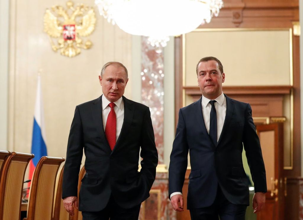 Russian President Vladimir Putin and Prime Minister Dmitry Medvedev speak before a meeting with members of the government in Moscow, Russia January 15, 2020. Sputnik/Dmitry Astakhov/Pool via REUTERS