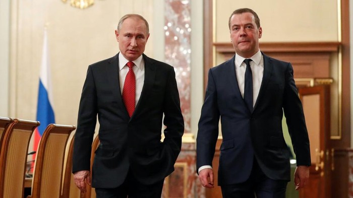 Russian President Vladimir Putin and Prime Minister Dmitry Medvedev speak before a meeting with members of the government in Moscow, Russia January 15, 2020. Sputnik/Dmitry Astakhov/Pool via REUTERS