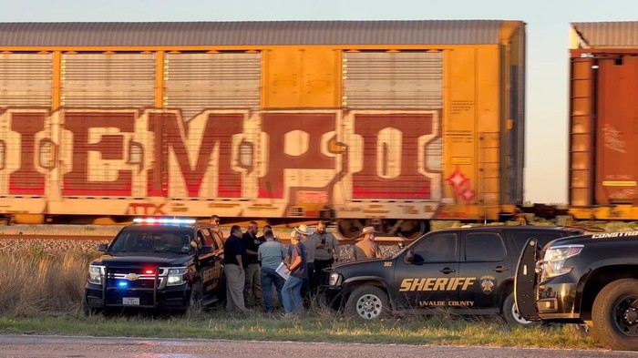 Members of the police work, after two migrants suffocated to death aboard a freight train that got derailed, in Uvalde, Texas, U.S, March 24, 2023, in this screengrab obtained from a social media video.? Joey Palacios via REUTERS