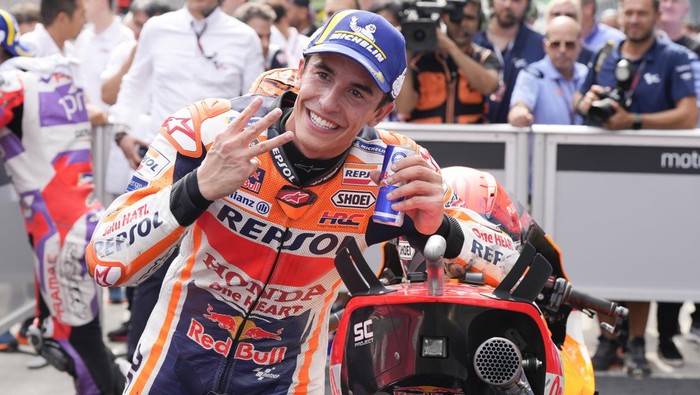 Spanish rider Marc Marquez of Repsol Honda Team celebrates after the MotoGP qualifying round for the Malaysia Motorcycle Grand Prix in Sepang International Circuit, Saturday, Oct. 22, 2022. Marquez took the third grid for the Sundays race. (AP Photo/Vincent Thian)