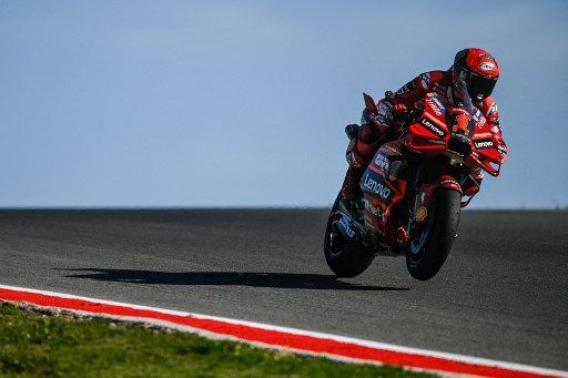 Ducati Italian rider Francesco Bagnaia rides during the warm-up before the MotoGP race of the Portuguese Grand Prix at the Algarve International Circuit in Portimao, on March 26, 2023. (Photo by PATRICIA DE MELO MOREIRA / AFP)