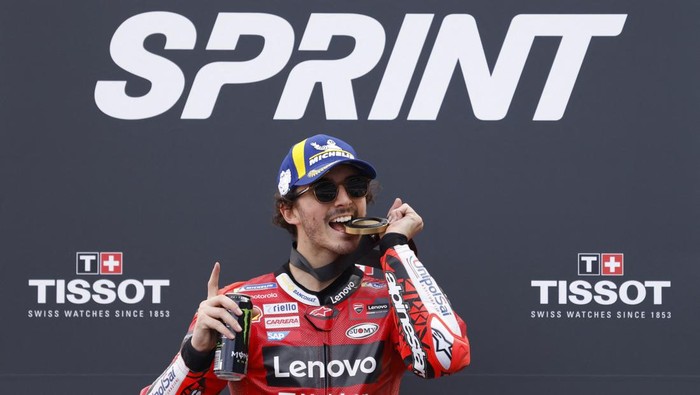 MotoGP - Portuguese Grand Prix - Algarve International Circuit, Portimao, Portugal - March 25, 2023 Ducati Lenovo Teams Francesco Bagnaia celebrates on a podium after winning the sprint race REUTERS/Marcelo Del Pozo