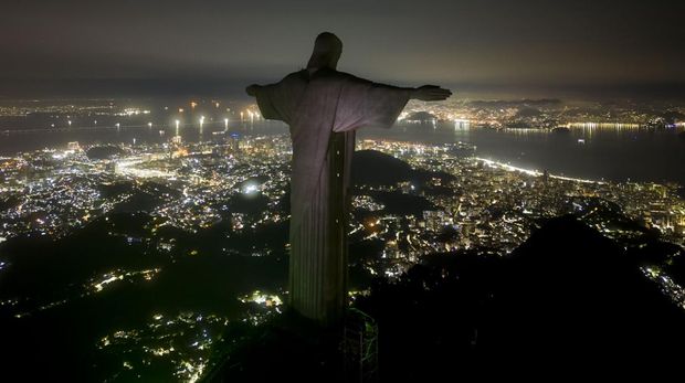 The Christ the Redeemer statue is seen after dark for Earth Hour on March 26, 2023 in Rio de Janeiro, Brazil.  (AP/Bruna Prado)