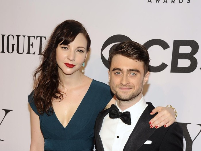Erin Darke and Daniel Radcliffe arrives at the 68th annual Tony Awards at Radio City Music Hall on Sunday, June 8, 2014, in New York. (Photo by Charles Sykes/Invision/AP)