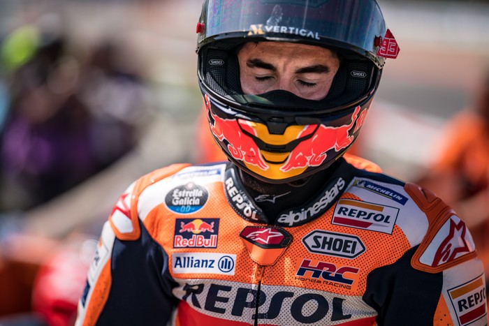 PORTIMAO, ALGARVE, PORTUGAL - MARCH 26: Marc Marquez of Spain and Repsol Honda Team walks out of the gravel, after he crashed with local hero Miguel Oliveira of Portugal and CryptoDATA RNF MotoGP Team during the race of the MotoGP Grande Prémio TISSOT de Portugal  at Autodromo do Algarve on March 26, 2023 in Portimao, Algarve, Portugal. (Photo by Steve Wobser/Getty Images)