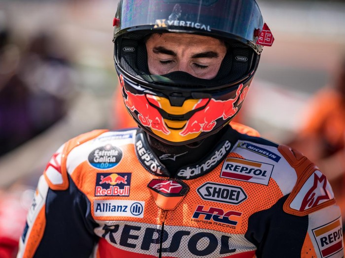 PORTIMAO, ALGARVE, PORTUGAL - MARCH 26: Marc Marquez of Spain and Repsol Honda Team walks out of the gravel, after he crashed with local hero Miguel Oliveira of Portugal and CryptoDATA RNF MotoGP Team during the race of the MotoGP Grande Prémio TISSOT de Portugal  at Autodromo do Algarve on March 26, 2023 in Portimao, Algarve, Portugal. (Photo by Steve Wobser/Getty Images)