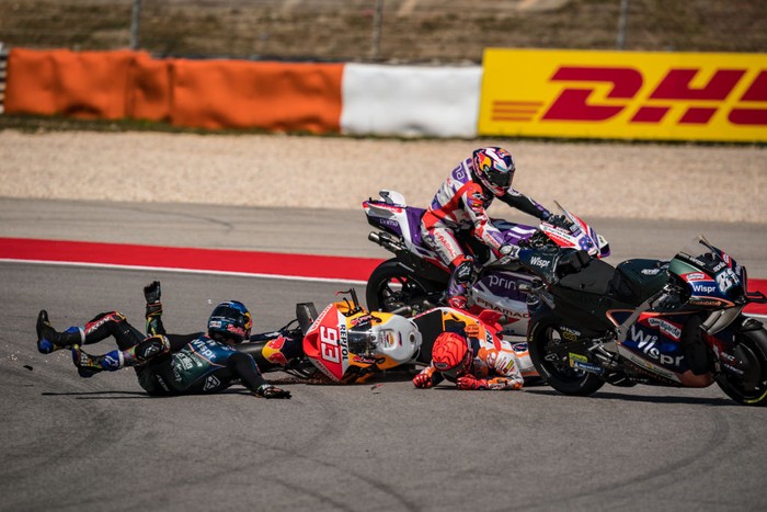 PORTIMAO, ALGARVE, PORTUGAL - MARCH 26: Marc Marquez of Spain and Repsol Honda Team crashed with local hero Miguel Oliveira of Portugal and CryptoDATA RNF MotoGP Team during the race of the MotoGP Grande Prémio TISSOT de Portugal  at Autodromo do Algarve on March 26, 2023 in Portimao, Algarve, Portugal. (Photo by Steve Wobser/Getty Images)