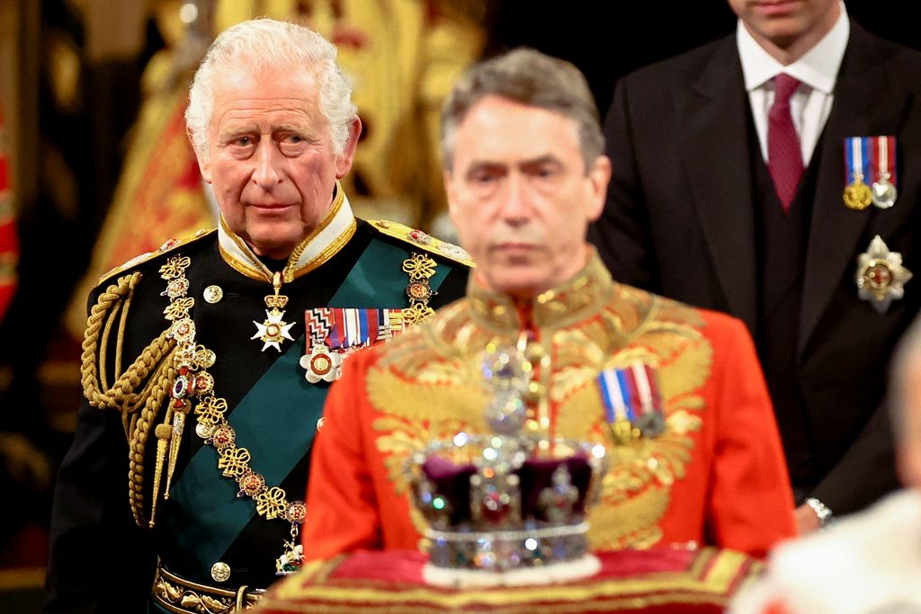 Britain's Prince Charles, Prince of Wales proceeds behind the Imperial State Crown through the Royal Gallery during the State Opening of Parliament at the Houses of Parliament, in London, on May 10, 2022. - The 96-year-old monarch, who usually presides over the pomp-filled event and reads out her government's legislative programme from a gilded throne in the House of Lords, will skip the annual showpiece on her doctors' advice. (Photo by HANNAH MCKAY / POOL / AFP) (Photo by HANNAH MCKAY/POOL/AFP via Getty Images)
