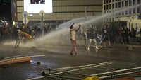 Sebagian dari mereka tak mundur meski ditembak water cannon.