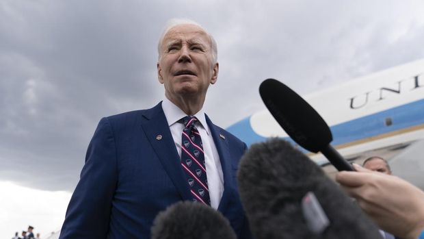 President Joe Biden speaks to reporters before boarding Air Force One at Raleigh-Durham International Airport in Morrisville, N.C., Tuesday, March 28, 2023, en route to Washington. (AP Photo/Carolyn Kaster)