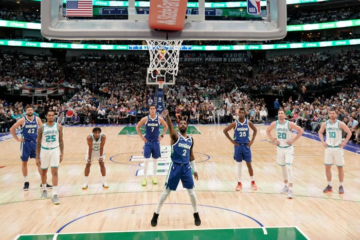DALLAS, TEXAS - MARCH 24: Kyrie Irving #2 of the Dallas Mavericks follows through on a free throw attempt during the first half against the Charlotte Hornets at American Airlines Center on March 24, 2023 in Dallas, Texas. NOTE TO USER: User expressly acknowledges and agrees that, by downloading and/or using this Photograph, user is consenting to the terms and conditions of the Getty Images License Agreement. (Photo by Sam Hodde/Getty Images)