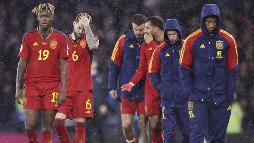 Spain players walk off dejected following a Euro 2024 group A qualifying soccer match between Scotland and Spain at the Hampden Park stadium in Glasgow, Scotland, Tuesday, March 28, 2023. (Steve Welsh/PA via AP)