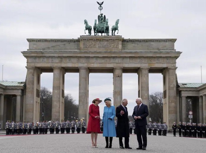 German President Frank-Walter Steinmeier, right, and his wife Elke Buedenbender, left, welcome Britains King Charles III and Camilla, the Queen Consort, in front of the Brandenburg Gate in Berlin, Wednesday, March 29, 2023. King Charles III arrived Wednesday for a three-day official visit to Germany. (AP Photo/Matthias Schrader)