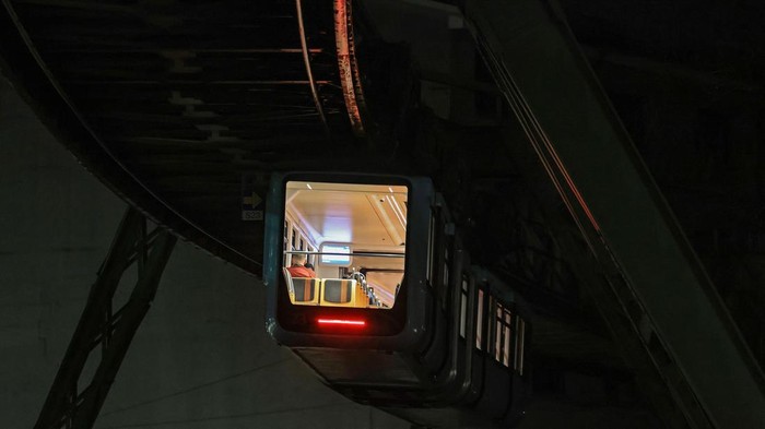 31 March 2023, North Rhine-Westphalia, Wuppertal: A train of the Wuppertal suspension railroad leaves a station. Photo: Oliver Berg/dpa (Photo by Oliver Berg/picture alliance via Getty Images)