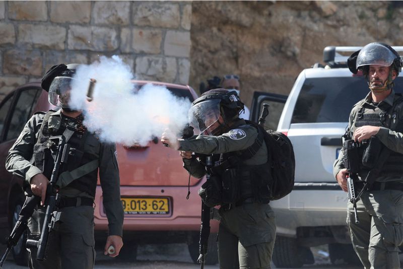 Israeli security forces use tear gas to disperse Palestinians demonstrating against the demolition of houses by Israeli authorities, following the Friday prayer in the Arab neighbourhood of Silwan in Israeli-annexed east Jerusalem, on March 3, 2023. (Photo by Ahmad GHARABLI / AFP) (Photo by AHMAD GHARABLI/AFP via Getty Images)