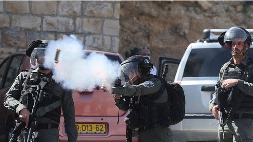 Israeli security forces use tear gas to disperse Palestinians demonstrating against the demolition of houses by Israeli authorities, following the Friday prayer in the Arab neighbourhood of Silwan in Israeli-annexed east Jerusalem, on March 3, 2023. (Photo by Ahmad GHARABLI / AFP) (Photo by AHMAD GHARABLI/AFP via Getty Images)