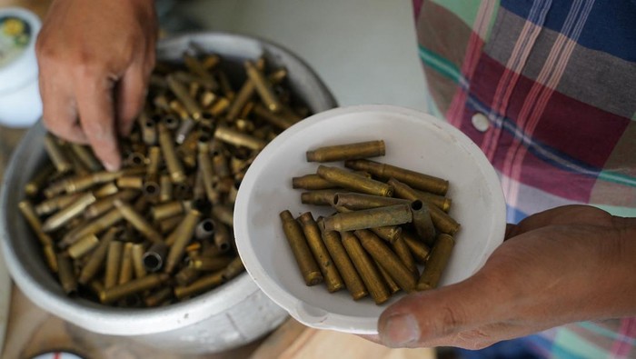 Thoeun Chantha poses at Angkor Bullet Jewelry workshop in Phnom Penh, Cambodia, March 29, 2023. REUTERS/Cindy Liu