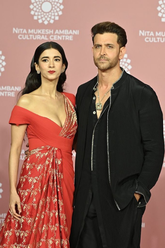 In this picture taken on April 1, 2023, Bollywood actor Hrithik Roshan with actress Saba Azad poses for pictures during the inauguration of the Nita Mukesh Ambani Cultural Centre (NMACC) at the Jio World Centre (JWC) in Mumbai. (Photo by SUJIT JAISWAL / AFP) (Photo by SUJIT JAISWAL/AFP via Getty Images)