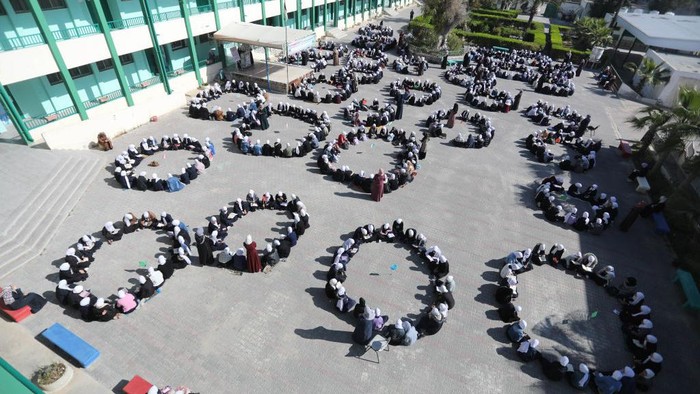 GAZA CITY, GAZA - APRIL 03: A view shows high school students gathering in thirty groups of twenty to read Quran in their breaktime during holy month of Ramadan at Nuseirat Refugee Camp in Gaza City, Gaza on April 03, 2023. (Photo by Ashraf Amra/Anadolu Agency via Getty Images)