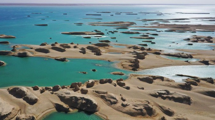 1478580328 HAIXI, CHINA - MARCH 30: Aerial view of Yardang rocks in the Wusute Yadan Geological Park in Qaidam Basin on March 30, 2023 in Haixi Mongolian and Tibetan Autonomous Prefecture, Qinghai Province of China. Lying in the Qaidam Basin, the Wusute Yadan Geological Park is home to a unique landscape which consists of wind-eroded rocks known as yardangs. (Photo by Ma Mingyan/China News Service/VCG via Getty Images)