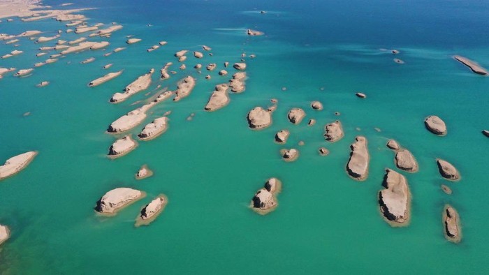 1478580328 HAIXI, CHINA - MARCH 30: Aerial view of Yardang rocks in the Wusute Yadan Geological Park in Qaidam Basin on March 30, 2023 in Haixi Mongolian and Tibetan Autonomous Prefecture, Qinghai Province of China. Lying in the Qaidam Basin, the Wusute Yadan Geological Park is home to a unique landscape which consists of wind-eroded rocks known as yardangs. (Photo by Ma Mingyan/China News Service/VCG via Getty Images)