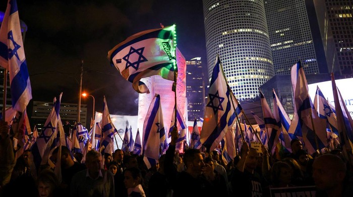 People take part in a demonstration against Israeli Prime Minister Benjamin Netanyahu and his nationalist coalition government's plan for judicial overhaul, in Tel Aviv, Israel April 1, 2023. REUTERS/Ronen Zvulun