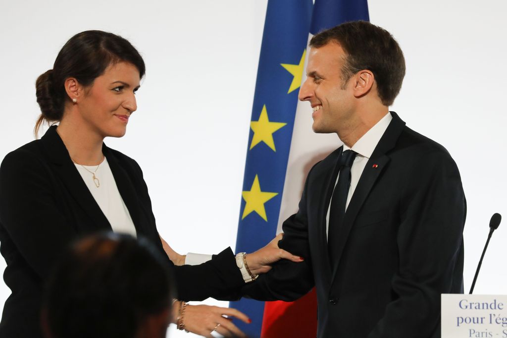 French President Emmanuel Macron (R) smiles to French Junior Minister for Gender Equality Marlene Schiappa after he delivered a speech during the International Day for the Elimination of Violence Against Women, on November 25, 2017 at the Elysee Palace in Paris. / AFP PHOTO / POOL / LUDOVIC MARIN        (Photo credit should read LUDOVIC MARIN/AFP via Getty Images)