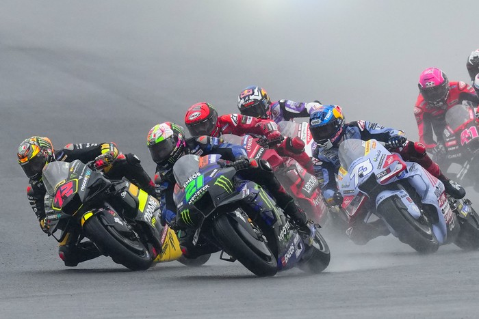 Italys Marco Bezzecchi rides his Ducati, left, Italys Franco Morbidelli rides his Yamaha, and Spains Alex Marquez rides his Ducati, right, at the start of the Moto GP race in Termas de Rio Hondo, Argentina, Sunday, April 2, 2023. (AP Photo/Natacha Pisarenko)