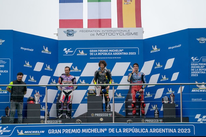 RIO HONDO, ARGENTINA - APRIL 02: MotoGP Top 3 riders on the podium with race winner Marco Bezzecchi of Italy and Mooney VR46 Racing Team (1st), Johann Zarco of France and Prima Pramac Racing (2nd) and Alex Marquez of Spain and Gresini Racing MotoGP (3rd) during the race of MotoGP Gran Premio Michelin de la República Argentina at Autodromo Termas de Rio Hondo on April 02, 2023 in Rio Hondo, Argentina. (Photo by Steve Wobser/Getty Images)