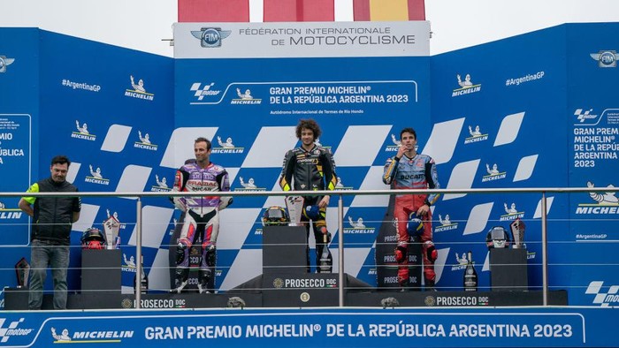 RIO HONDO, ARGENTINA - APRIL 02: MotoGP Top 3 riders on the podium with race winner Marco Bezzecchi of Italy and Mooney VR46 Racing Team (1st), Johann Zarco of France and Prima Pramac Racing (2nd) and Alex Marquez of Spain and Gresini Racing MotoGP (3rd) during the race of MotoGP Gran Premio Michelin de la República Argentina at Autodromo Termas de Rio Hondo on April 02, 2023 in Rio Hondo, Argentina. (Photo by Steve Wobser/Getty Images)