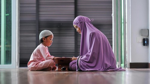 Muslim family worship during ramadhan