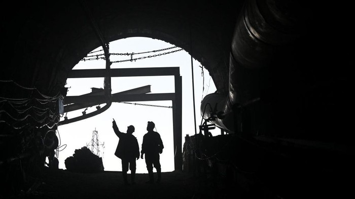 MANISA, TURKIYE - MARCH 27: Miners pray before iftar (breaking the fast) time at mine site, one of Turkiyes major lignite coal production centers, during the holy month of Ramadan in Soma district of Manisa, Turkiye on March 25, 2023. About 500 miners in the mining company returned to the mine site on after participating in search and rescue operation following 7.7 and 7.6 magnitude earthquakes hit multiple provinces of Turkiye occurred on Feb. 06. The miners, who work hundreds of meters below the site according to their shifts, also fulfill the requirements of the holy month of Ramadan despite their difficult professions. According to their working hours, they spend their iftar and sahur (pre-dawn) together. (Photo by Mahmut Serdar Alakus/Anadolu Agency via Getty Images)