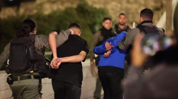 JERUSALEM - APRIL 5: Israeli police detained some Palestinians after Israeli police again raided the Al-Aqsa Mosque complex in East Jerusalem early Sunday in Jerusalem on April 5, 2023. Israeli police cut the electricity and forced Palestinians out of the Qibla Masjid who were performing prayers. Palestinians attempted to prevent police by closing the doors to the mosque. (Photo by Mostafa Alkharouf/Anadolu Agency via Getty Images)