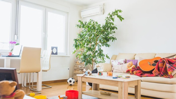 Untidy living room. Childrens toys all around a place