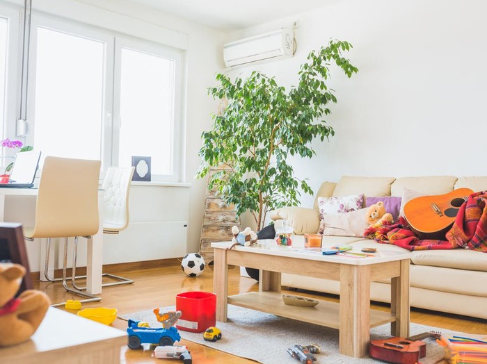 Untidy living room. Childrens toys all around a place