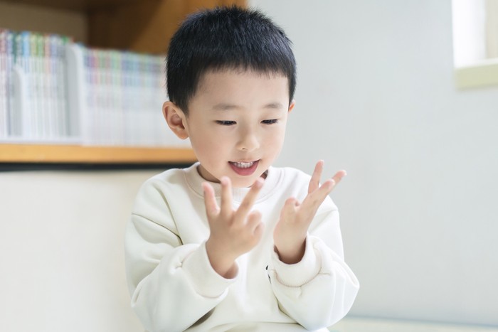 Asian mother teaching child ​boy Learning math with an abacus, education concept, home school, Social distancing, stay home, online learning class study math